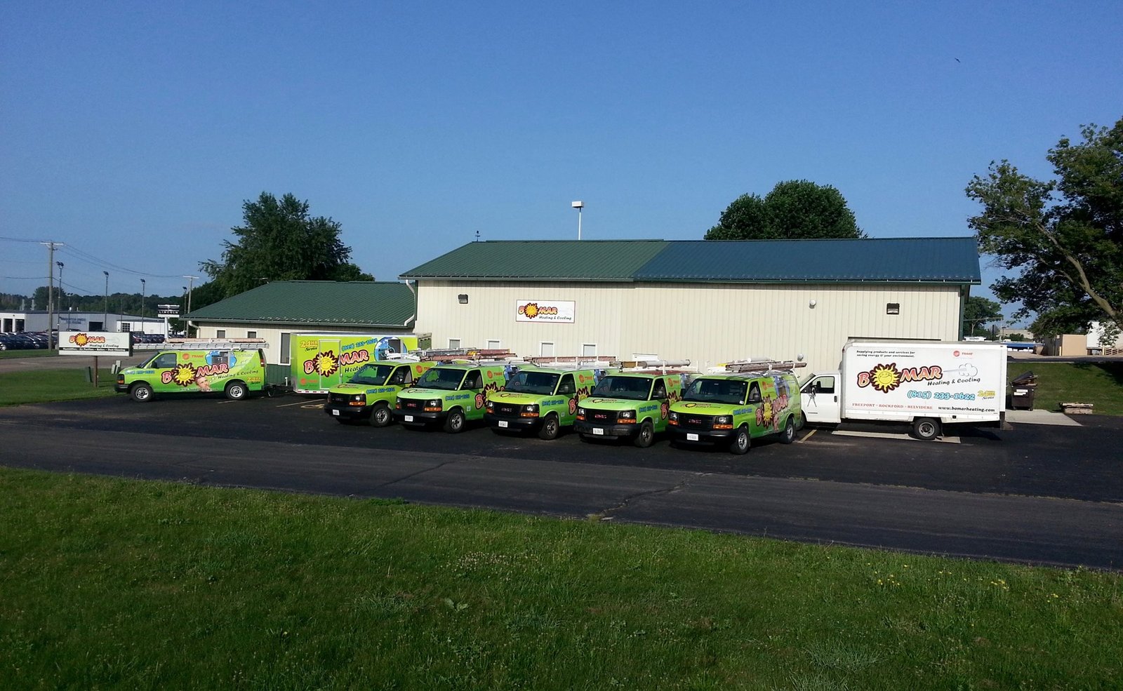 Bomar Heating and Cooling service vehicles parked outside the Freeport location